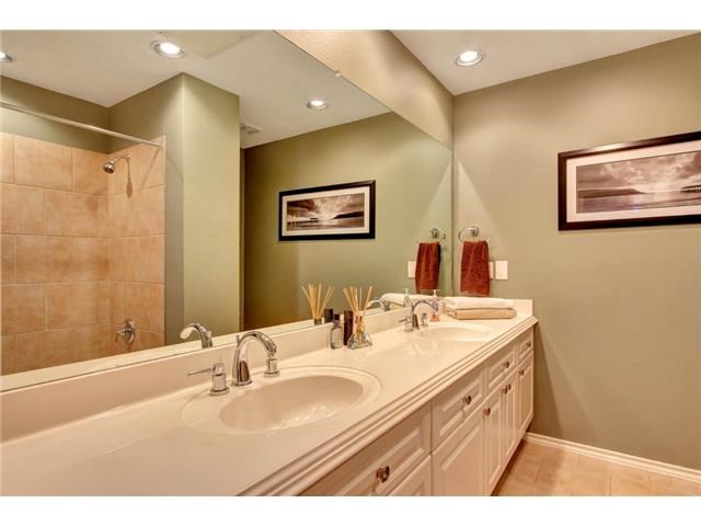 2918 Ranch Road 620, Unit K170 Austin, TX 78734 - Photo 9 of 22 Double vanity with ample counter space and mirrored walls creates a spacious feel in this well-lit bathroom.