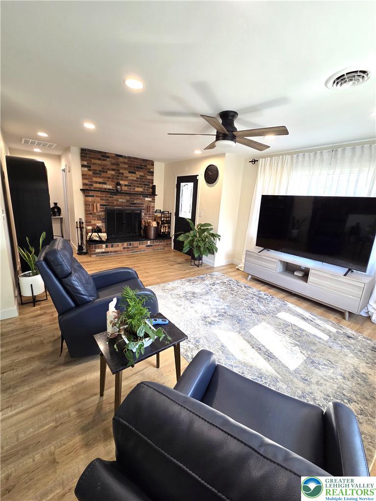 89 Short Ridge Road Albrightsville, PA 18210 - Photo 10 of 71 A classic brick fireplace anchors this inviting space with warm wood flooring and recessed lighting.