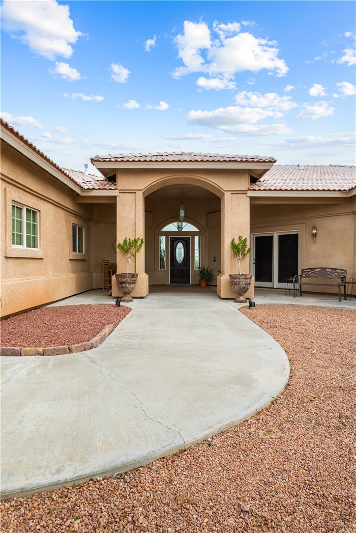2898 Mountain Trail Road Kingman, AZ 86401 - Photo 59 of 75 a view of a house with barbeque and wooden fence