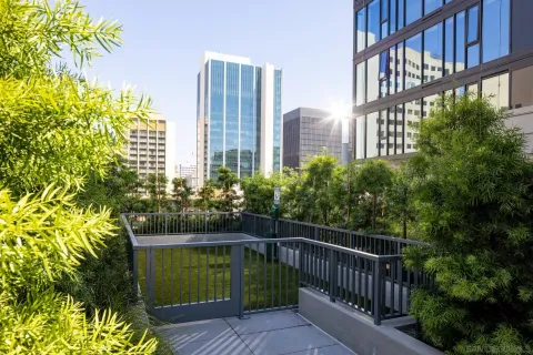 a lobby with furniture and floor to ceiling window
