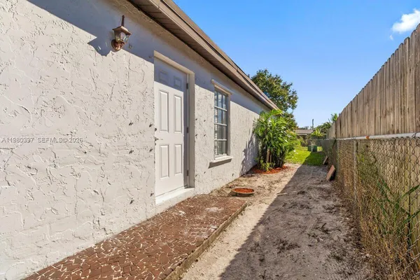 a view of a back yard of the house