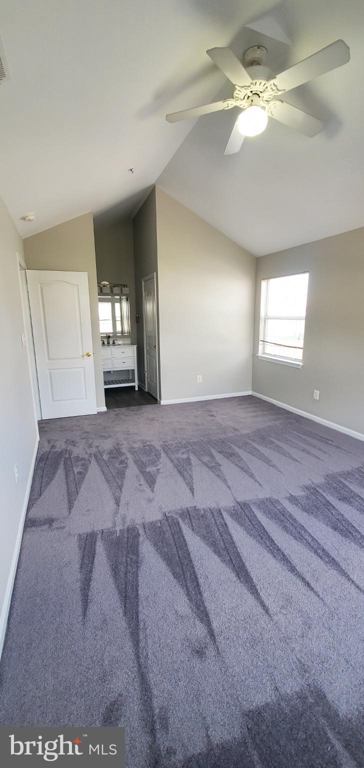 8343 Montgomery Run Road Ellicott City, MD 21043 - Photo 6 of 36 Spacious room with vaulted ceiling and light.