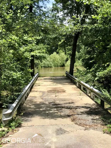 a view of a swimming pool and a yard