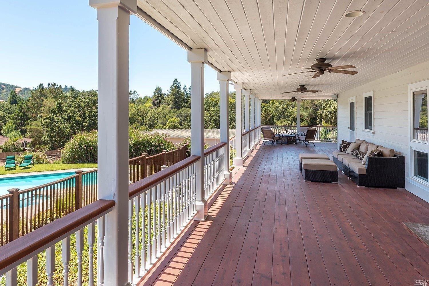 1340 Riebli Road Santa Rosa, CA 95404 - Photo 1 of 1 a view of a balcony with chairs and wooden floor