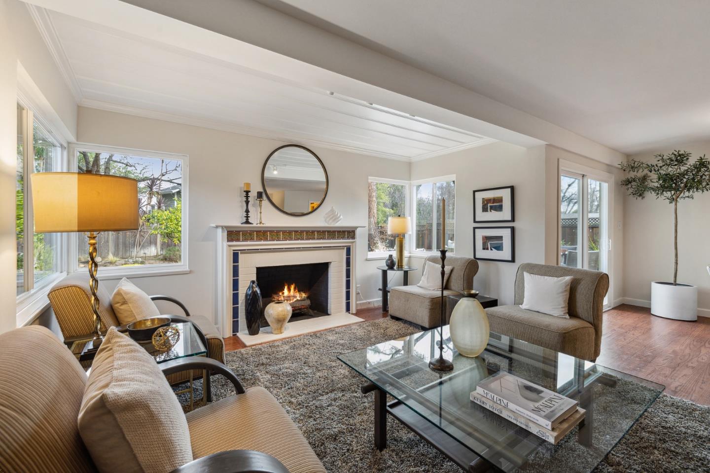671 Covington Road Los Altos, CA 94024 - Photo 11 of 38 a living room with furniture a fireplace and a flat screen tv