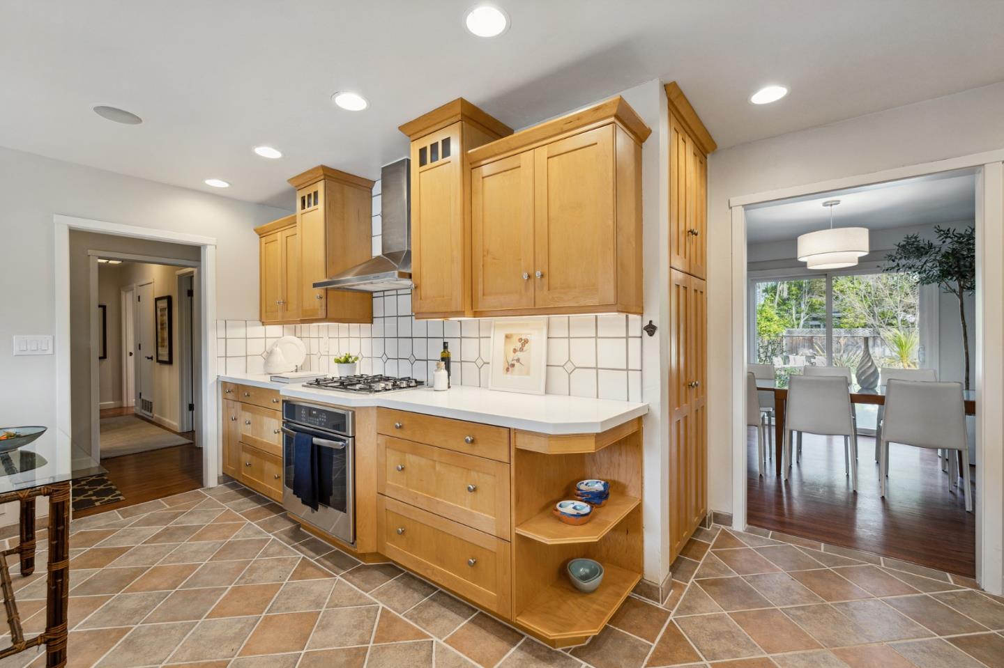 671 Covington Road Los Altos, CA 94024 - Photo 19 of 38 a kitchen with stainless steel appliances granite countertop a stove a sink and a refrigerator