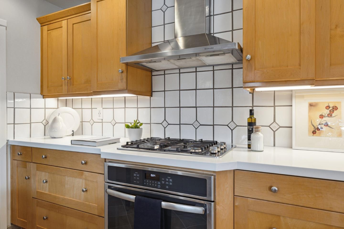 671 Covington Road Los Altos, CA 94024 - Photo 20 of 38 a kitchen with stainless steel appliances granite countertop a sink stove and cabinets