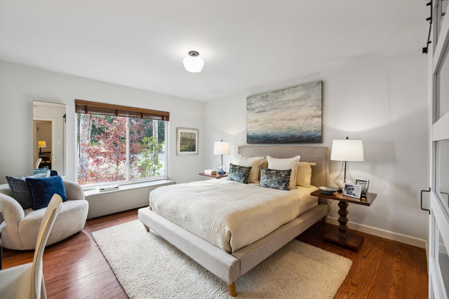 671 Covington Road Los Altos, CA 94024 - Photo 21 of 38 a bedroom with a bed and wooden floor