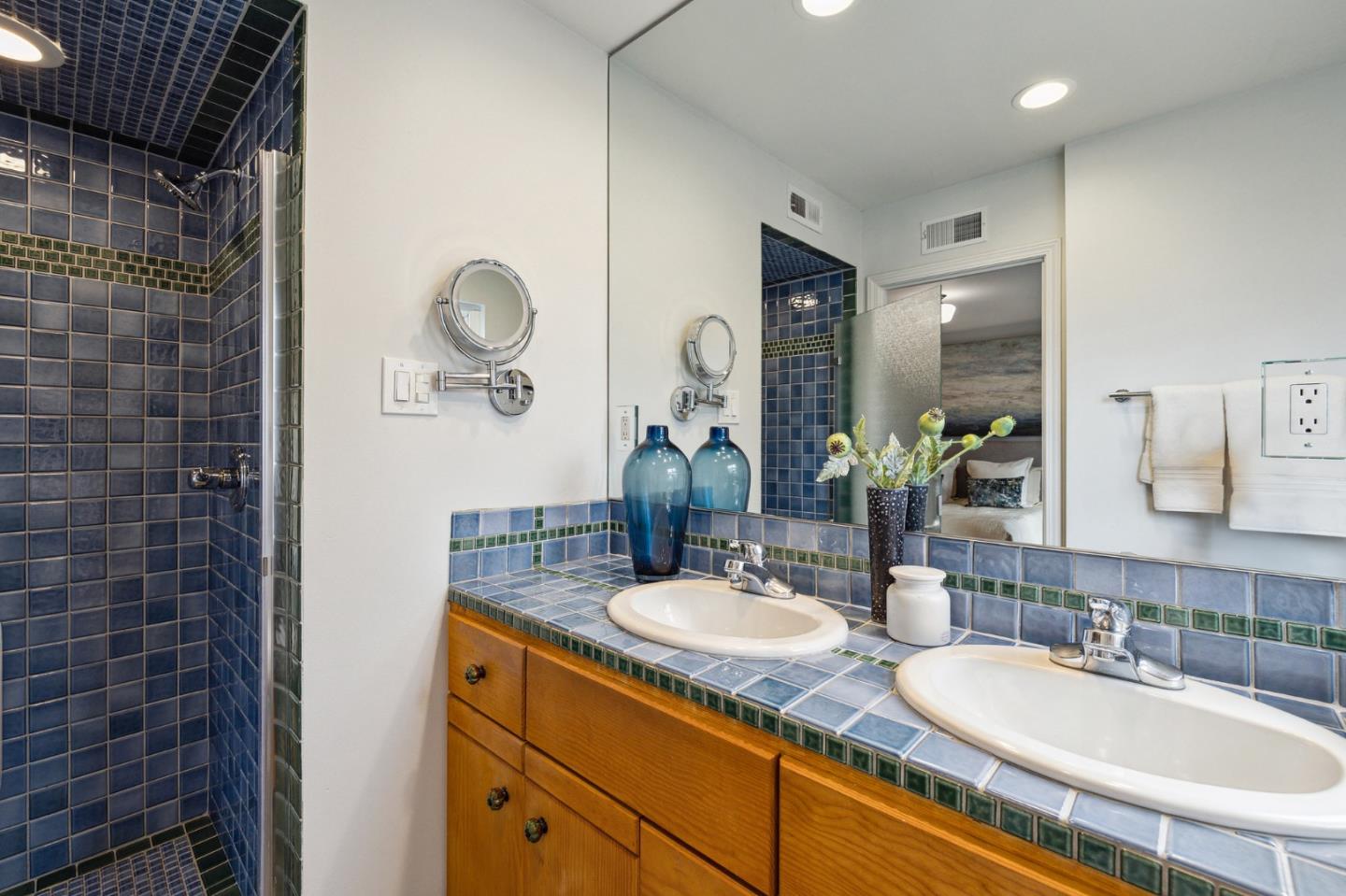 671 Covington Road Los Altos, CA 94024 - Photo 25 of 38 a bathroom with a granite countertop sink a mirror and shower