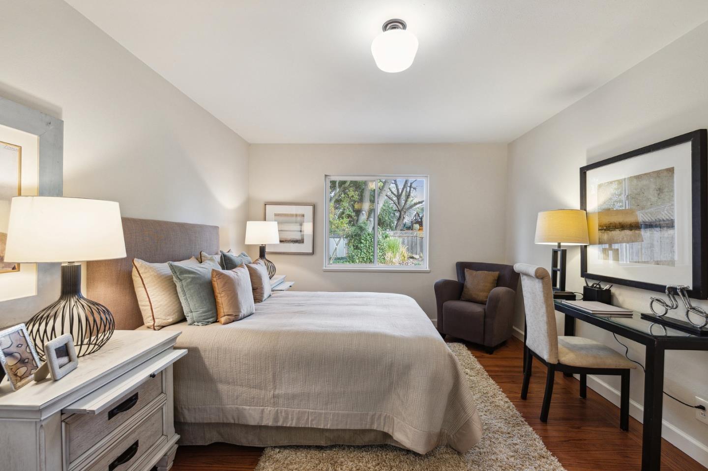 671 Covington Road Los Altos, CA 94024 - Photo 30 of 38 a bedroom with a bed and a lamp on dresser