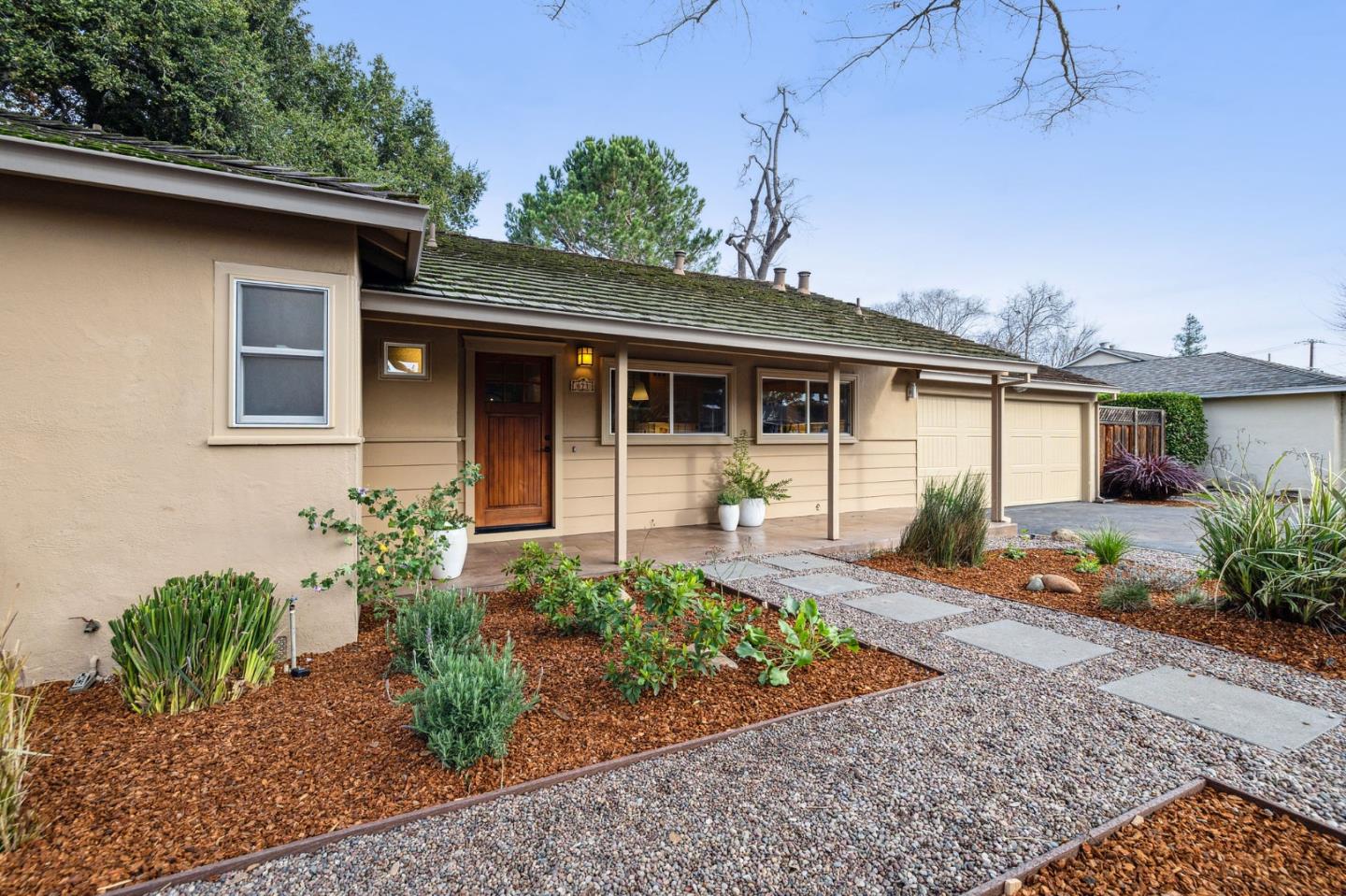 671 Covington Road Los Altos, CA 94024 - Photo 4 of 38 a front view of a house with garden