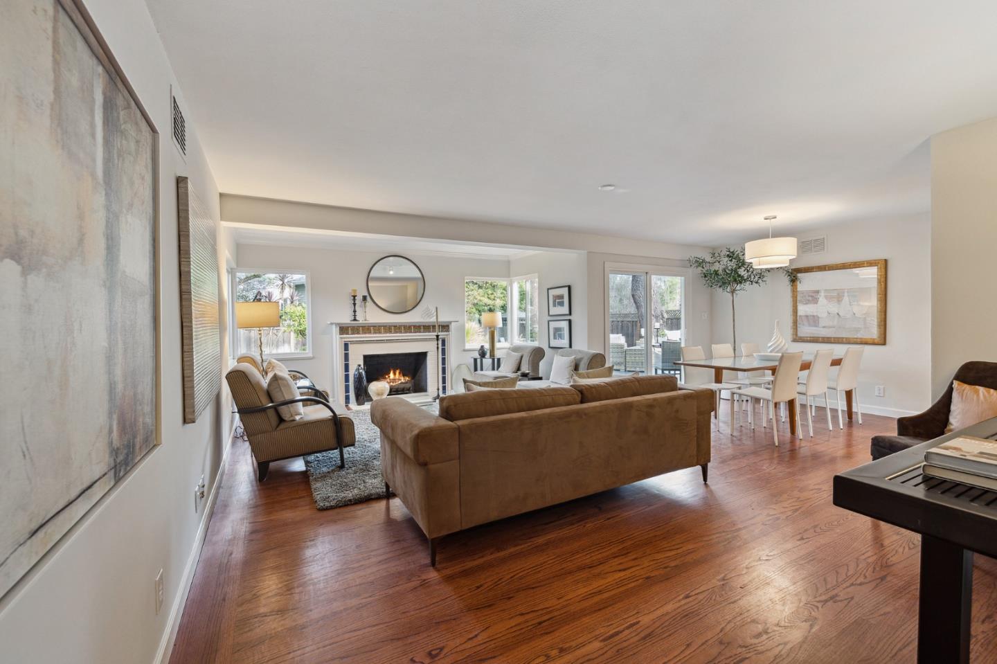 671 Covington Road Los Altos, CA 94024 - Photo 8 of 38 a living room with furniture a fireplace and a window