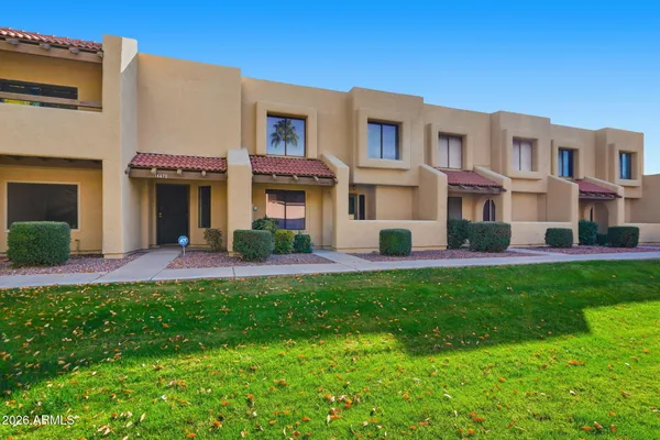 a front view of a house with a yard