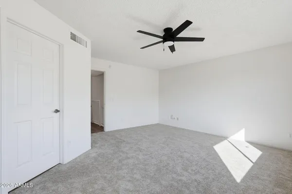 a view of a big room with wooden floor and closet in a kitchen