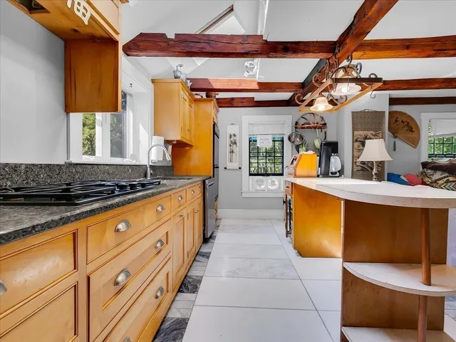 a kitchen with sink and cabinets