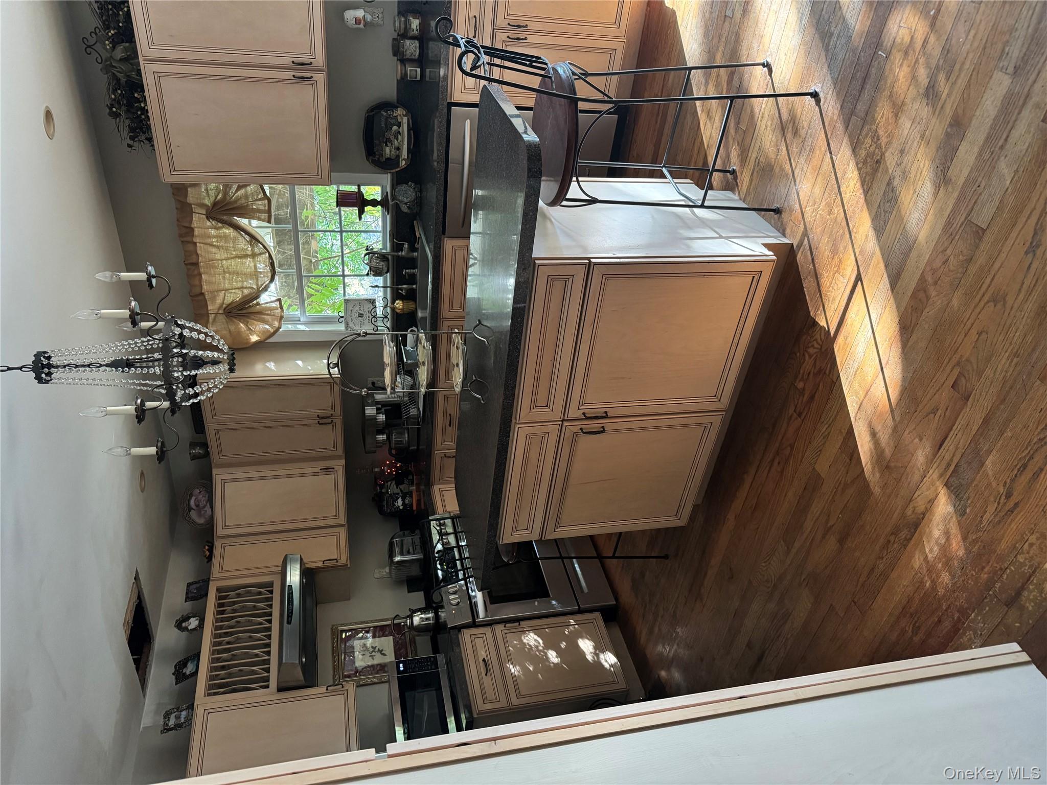 43 North Cozine Road Manorville, NY 11949 - Photo 12 of 42 Kitchen with a kitchen bar, light brown cabinetry, and range