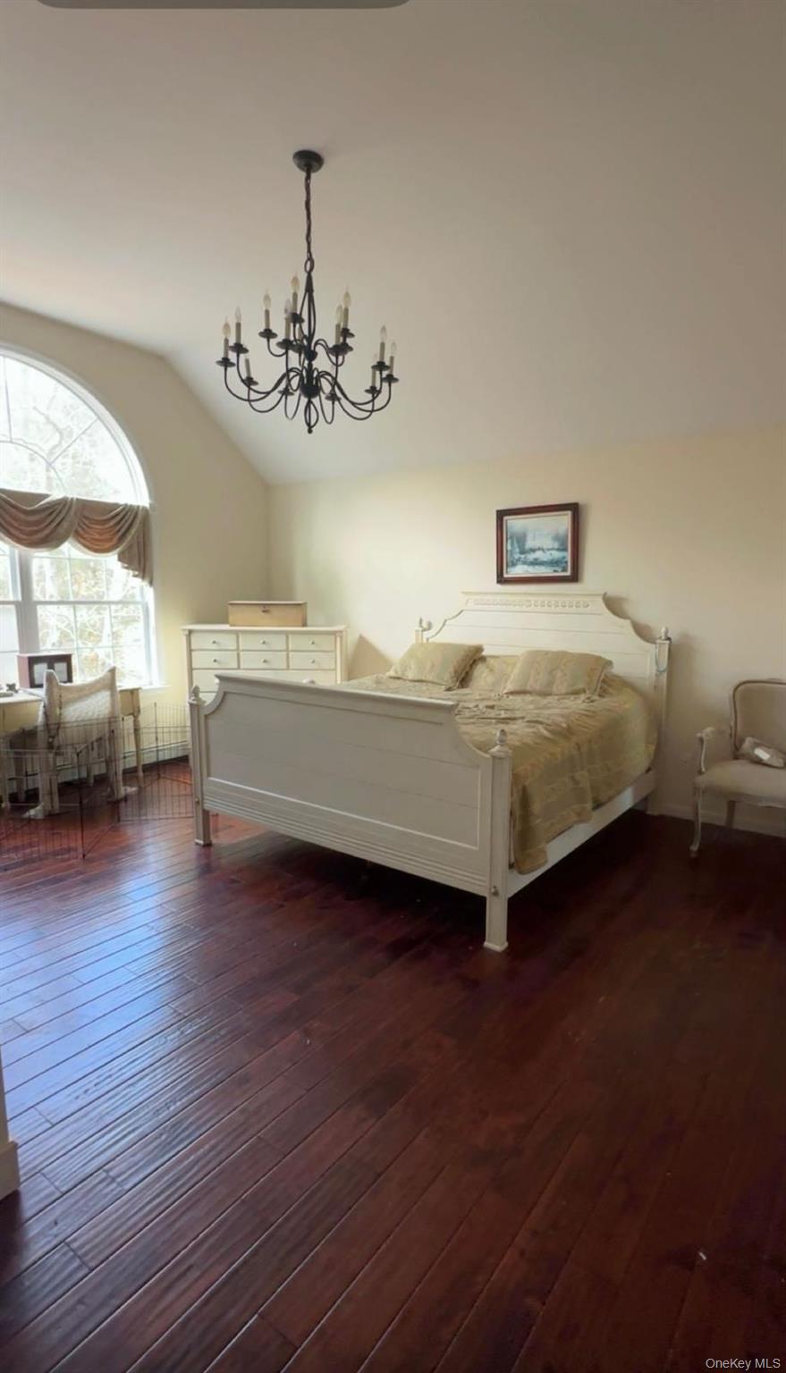 43 North Cozine Road Manorville, NY 11949 - Photo 18 of 42 Bedroom with lofted ceiling, dark wood-style floors, and a chandelier