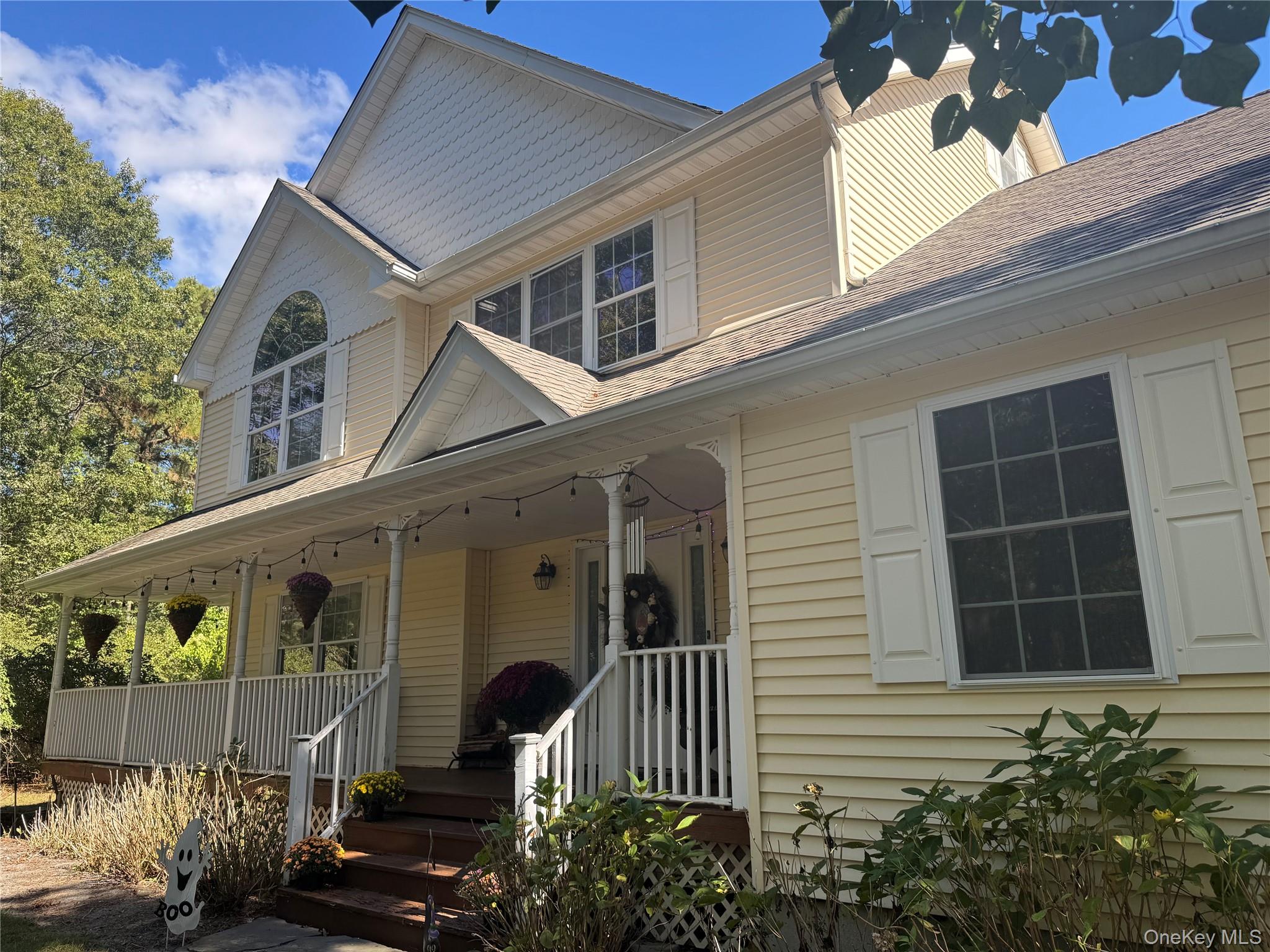 43 North Cozine Road Manorville, NY 11949 - Photo 2 of 42 View of front of property featuring a porch and roof with shingles