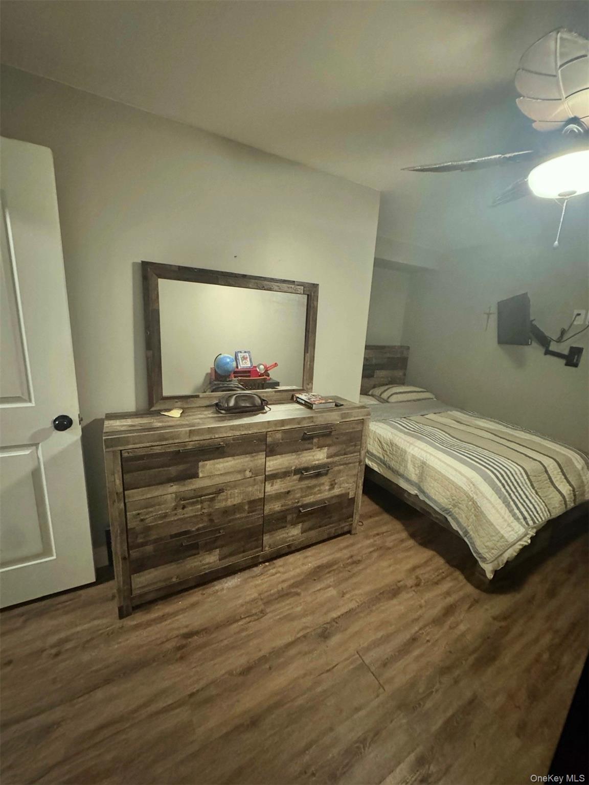 43 North Cozine Road Manorville, NY 11949 - Photo 31 of 42 Bedroom with dark wood-style floors and ceiling fan