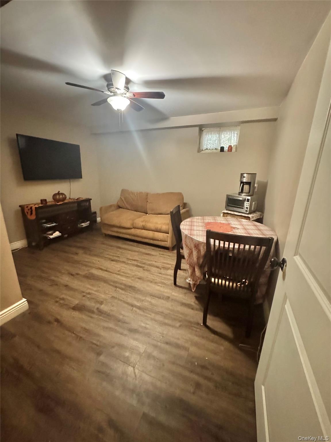 43 North Cozine Road Manorville, NY 11949 - Photo 32 of 42 Living area with dark wood-style flooring and ceiling fan