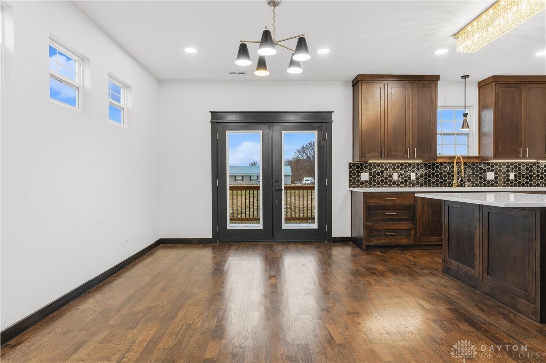 3509 South State Rte 72 Sabina, OH 45169 - Photo 10 of 44 This bright space features rich hardwood flooring and a stylish kitchen island, perfect for gathering.
