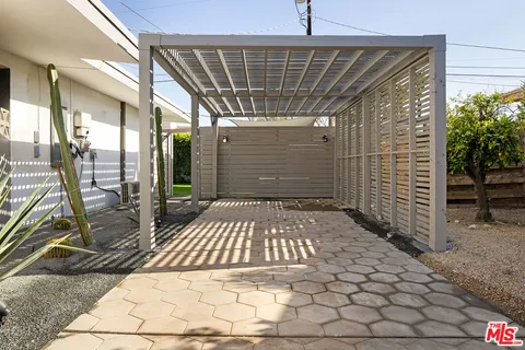 a view of swimming pool with outdoor seating