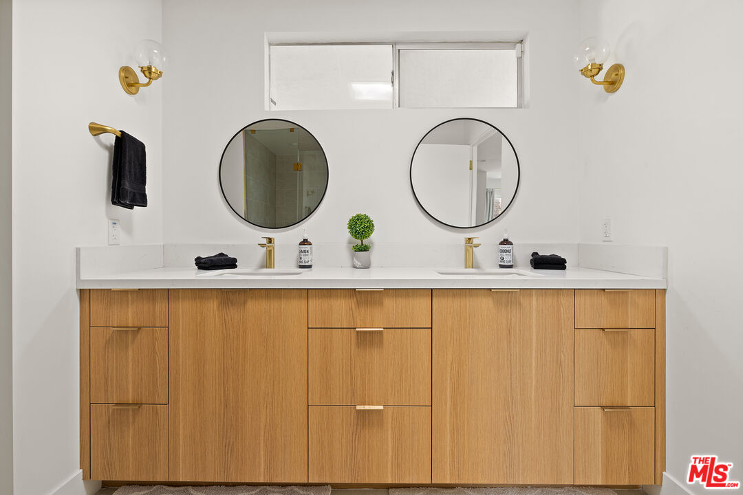 74085 Setting Sun Trail Palm Desert, CA 92260 - Photo 21 of 52 a bathroom with a sink and a mirror