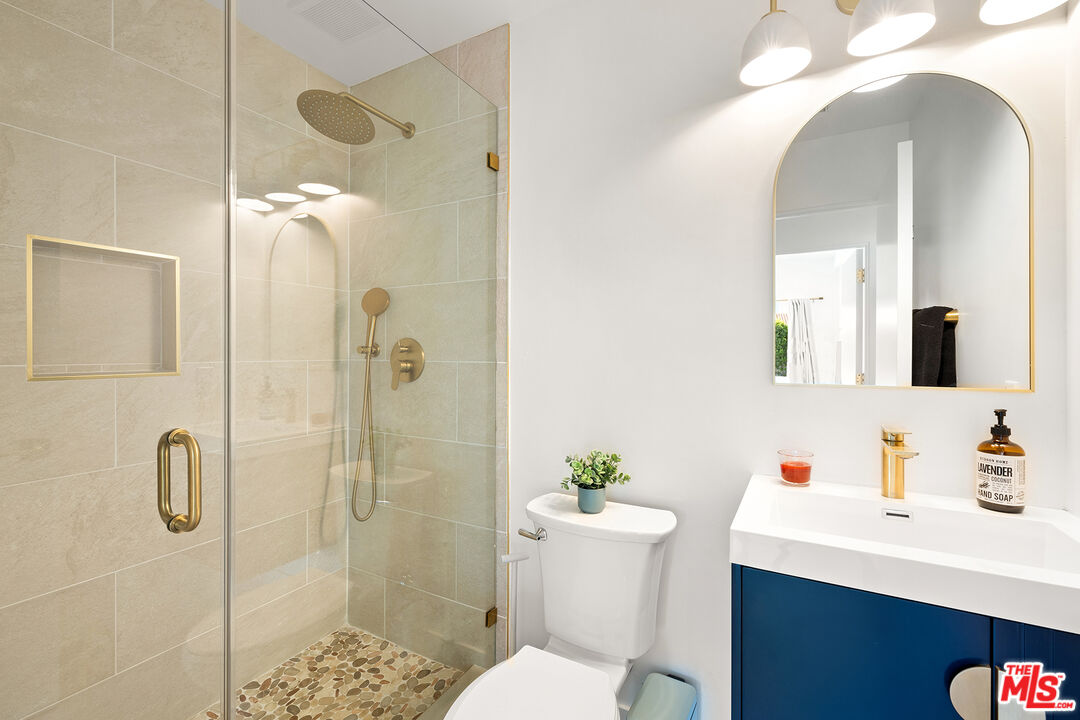 74085 Setting Sun Trail Palm Desert, CA 92260 - Photo 25 of 52 a bathroom with a sink toilet and shower