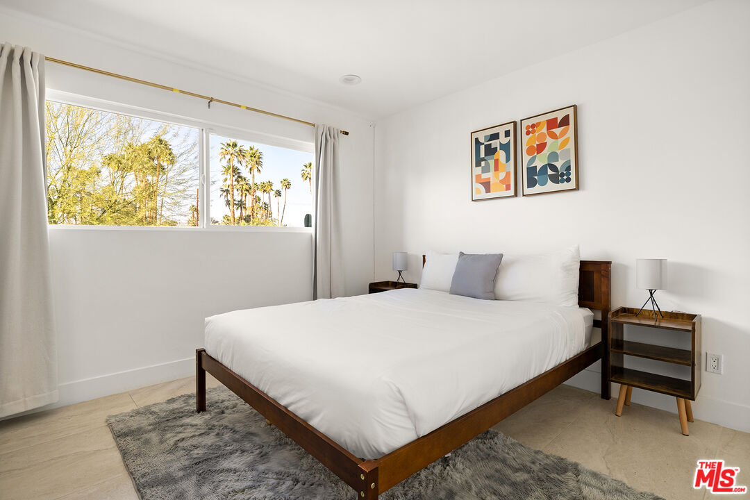 74085 Setting Sun Trail Palm Desert, CA 92260 - Photo 26 of 52 a bedroom with a bed and a window