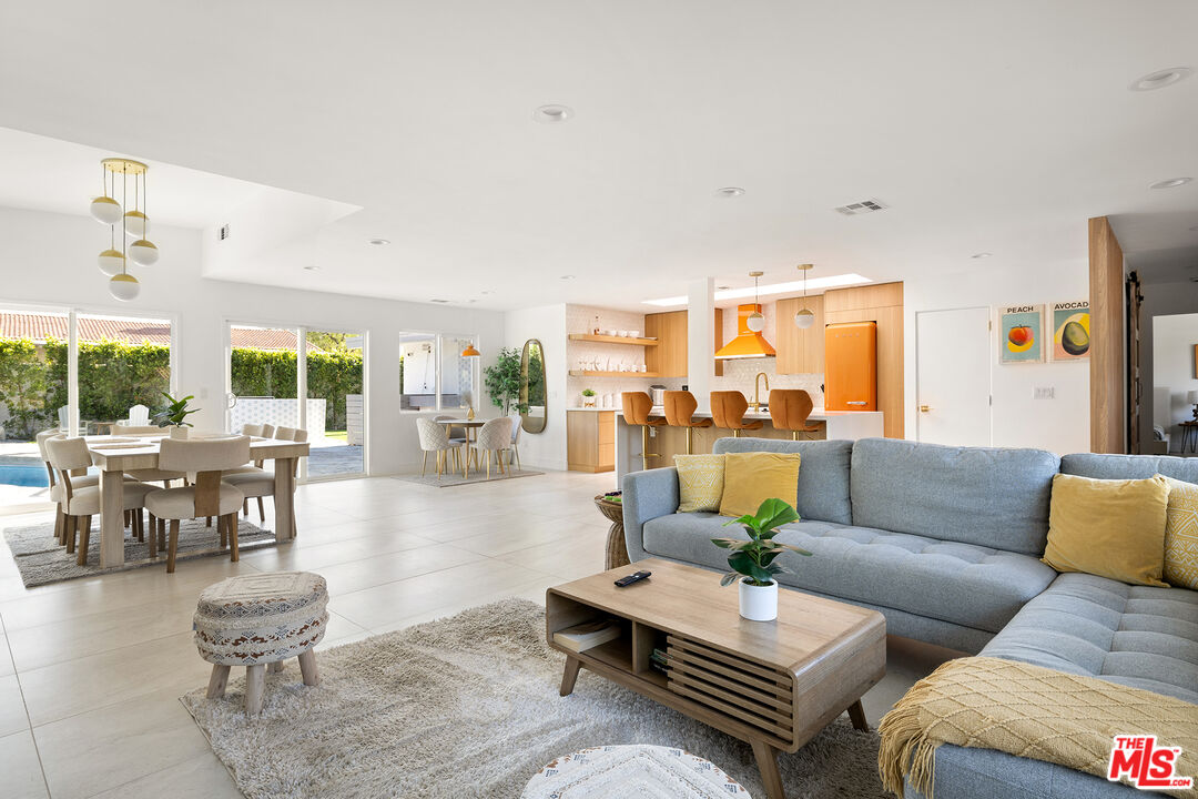 74085 Setting Sun Trail Palm Desert, CA 92260 - Photo 3 of 52 a living room with furniture and a large window