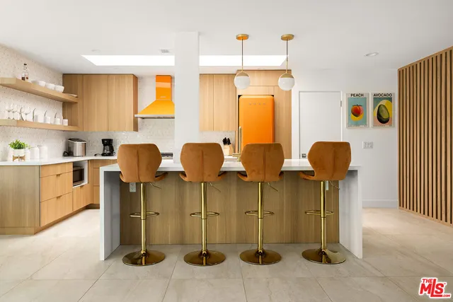 a kitchen with stainless steel appliances granite countertop a sink and a stove