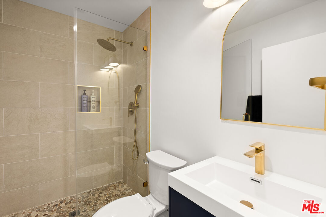 74085 Setting Sun Trail Palm Desert, CA 92260 - Photo 43 of 52 a bathroom with a sink and a mirror