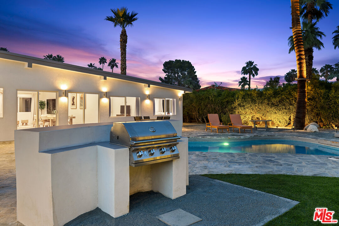 74085 Setting Sun Trail Palm Desert, CA 92260 - Photo 50 of 52 a view of a fountain with a swimming pool