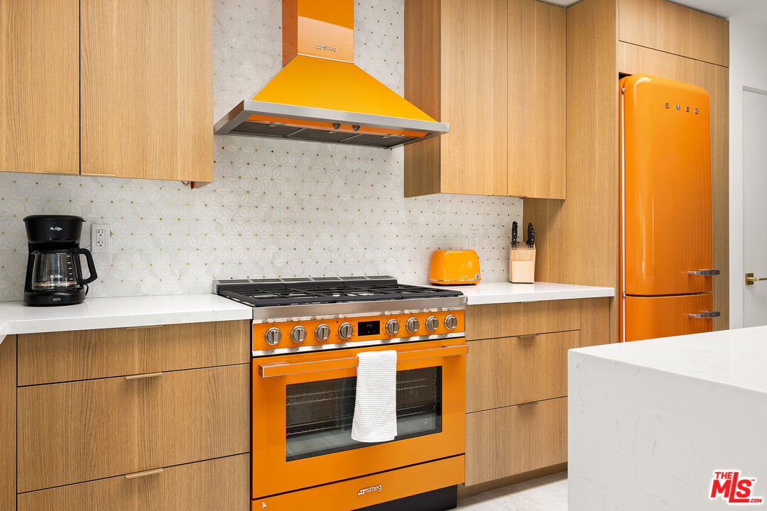 74085 Setting Sun Trail Palm Desert, CA 92260 - Photo 6 of 52 a kitchen with a stove and a white cabinets