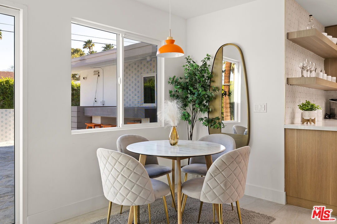 74085 Setting Sun Trail Palm Desert, CA 92260 - Photo 9 of 52 a dining room with furniture and window