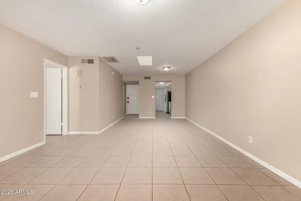 a view of an empty room with a window