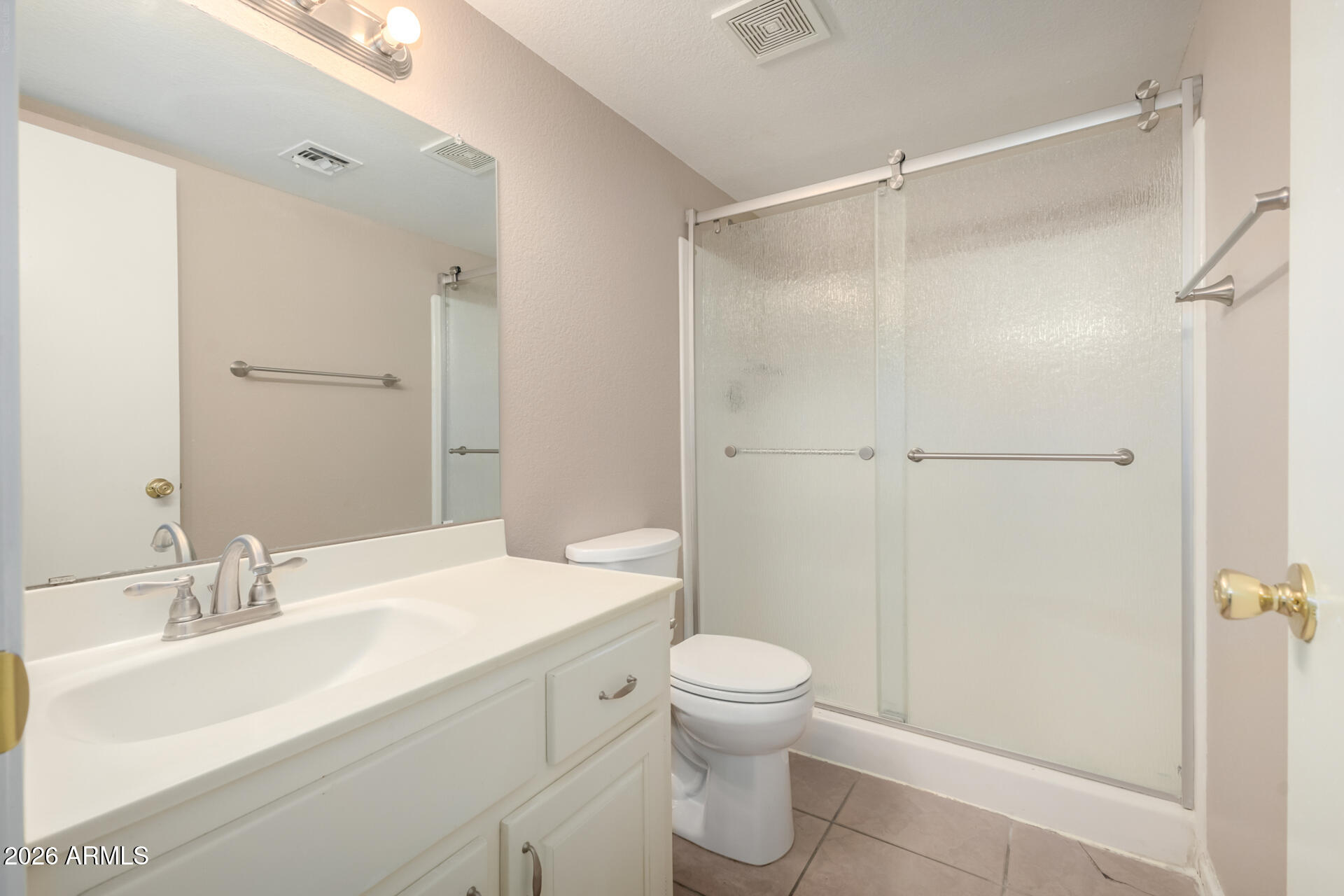 4529 West McLellan Road Glendale, AZ 85301 - Photo 20 of 35 a bathroom with a sink toilet and shower