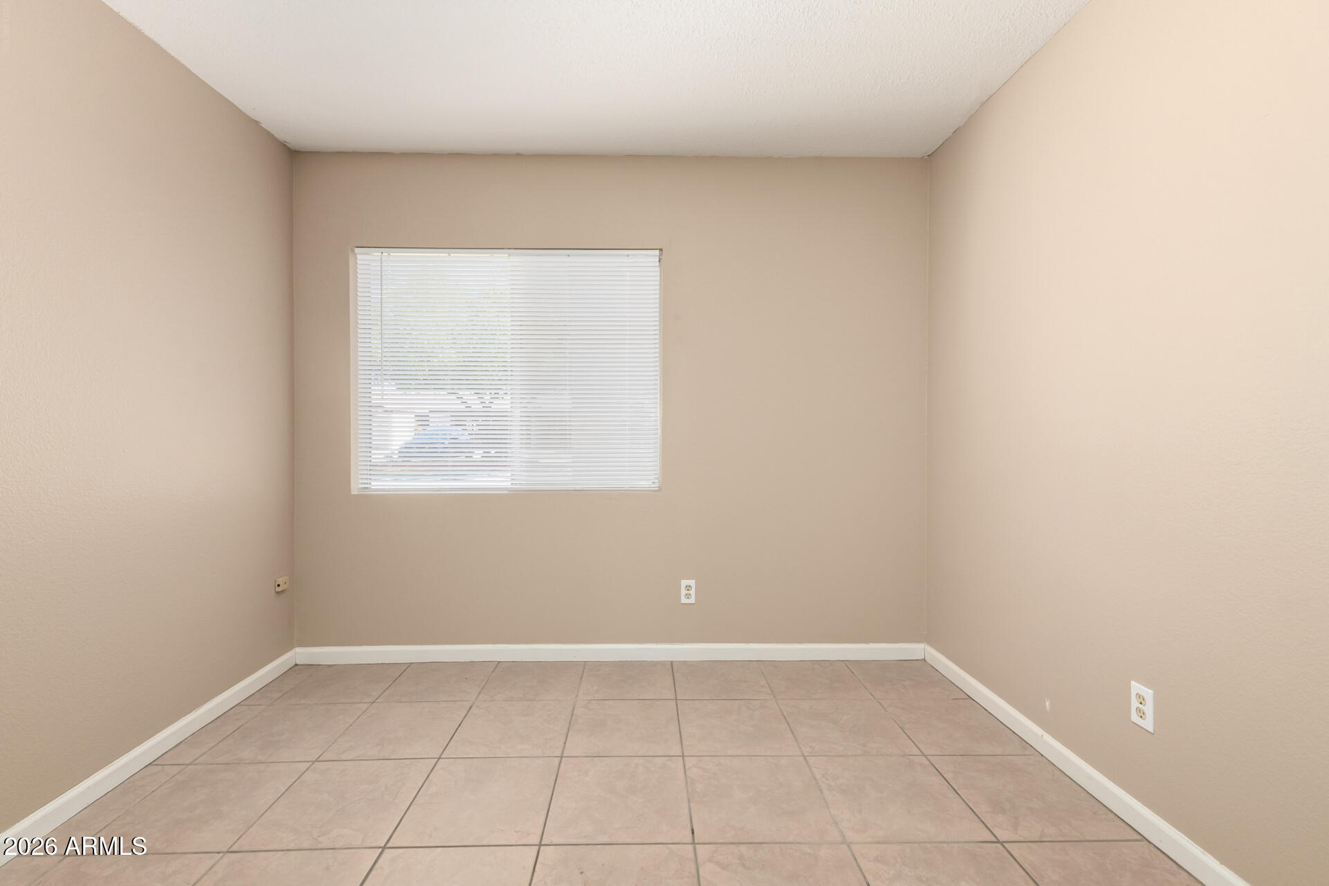 4529 West McLellan Road Glendale, AZ 85301 - Photo 25 of 35 an empty room with a window