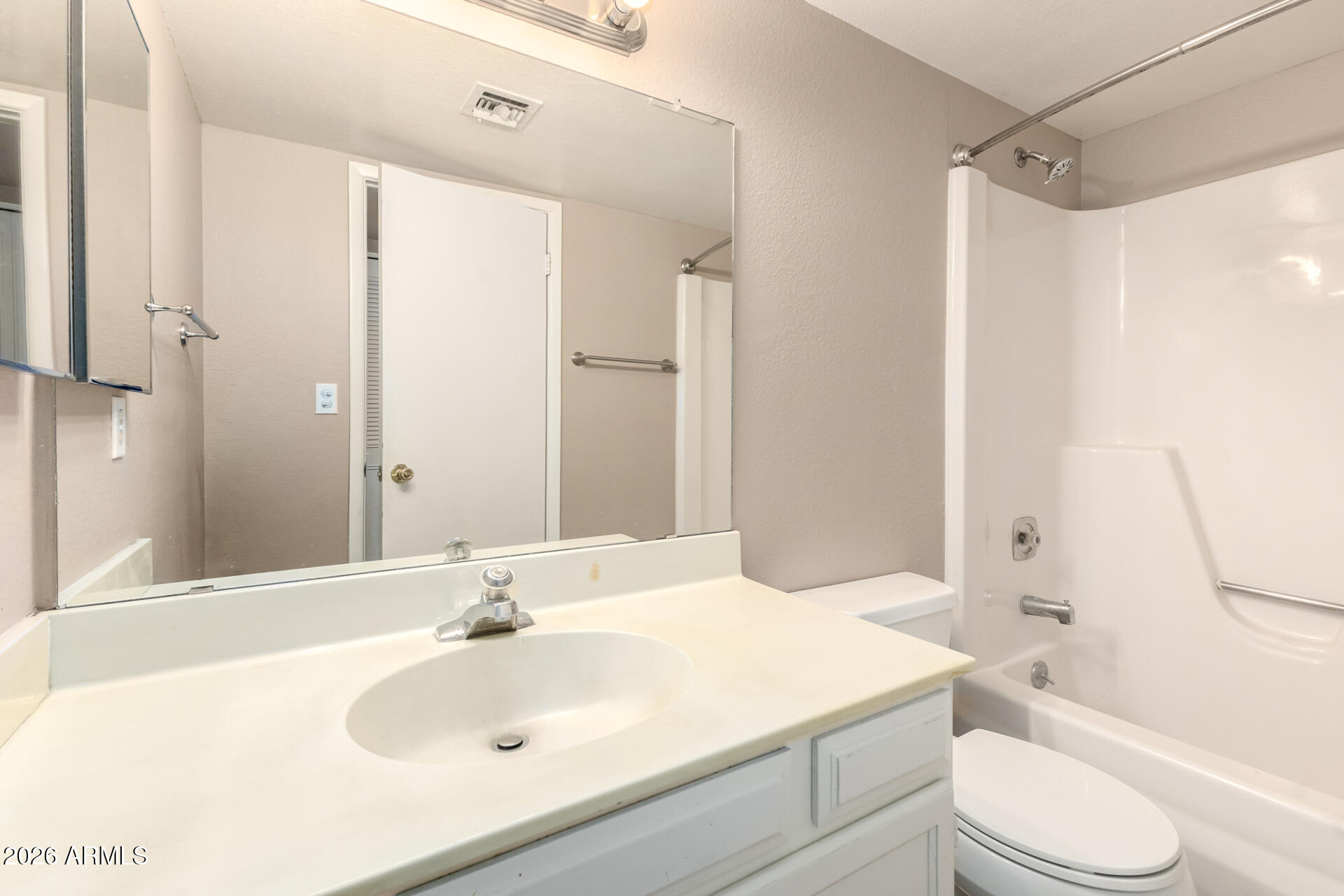 4529 West McLellan Road Glendale, AZ 85301 - Photo 27 of 35 a bathroom with a sink toilet and shower