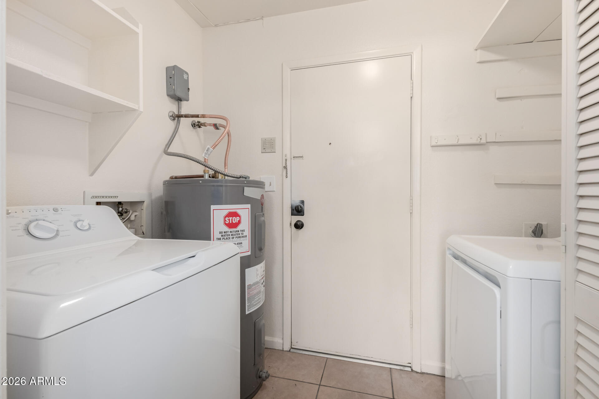 4529 West McLellan Road Glendale, AZ 85301 - Photo 28 of 35 a utility room with dryer and washer