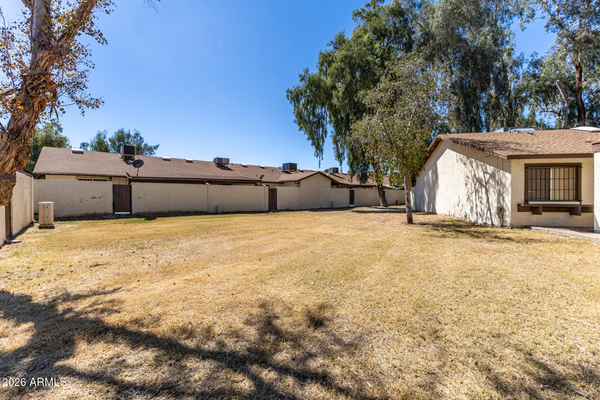 4529 West McLellan Road Glendale, AZ 85301 - Photo 32 of 35 a view of a house with a yard