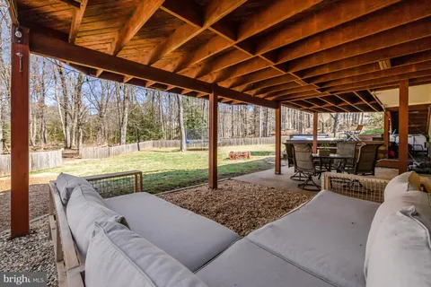 a view of swimming pool with outdoor seating