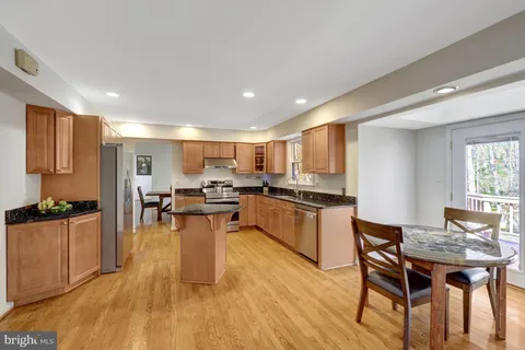 a kitchen with a table and chairs in it