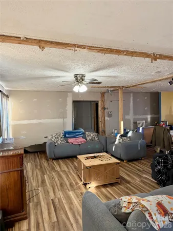 a living room with furniture and a lamp