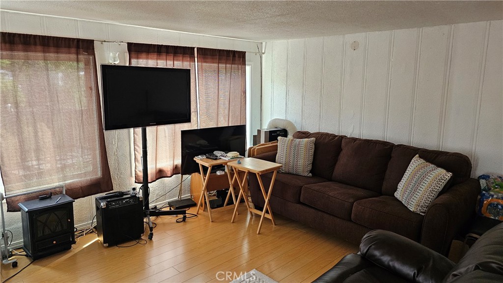 16067 Dam Road Clearlake, CA 95422 - Photo 12 of 30 a living room with furniture and a flat screen tv