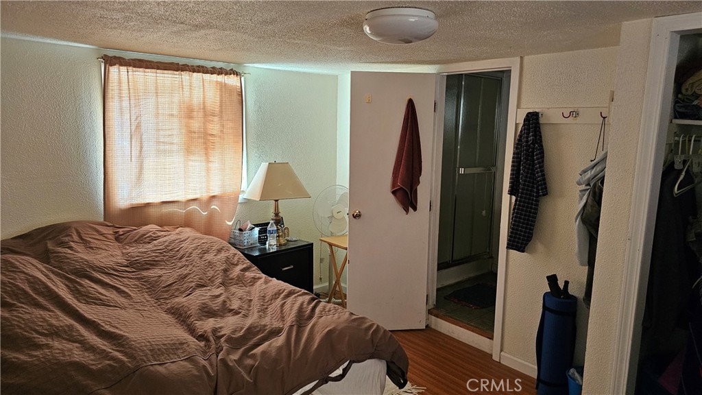 16067 Dam Road Clearlake, CA 95422 - Photo 15 of 30 a bedroom with a bed and a window