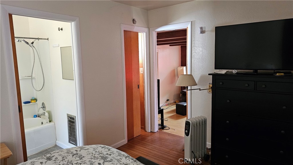16067 Dam Road Clearlake, CA 95422 - Photo 27 of 30 a bedroom with a bed and a flat screen tv