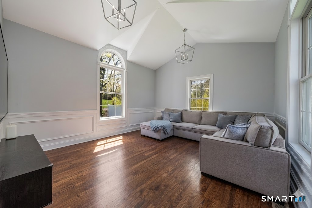 9 Sunset Ridge Drive Guilford, CT 06437 - Photo 15 of 40 a living room with furniture and a window