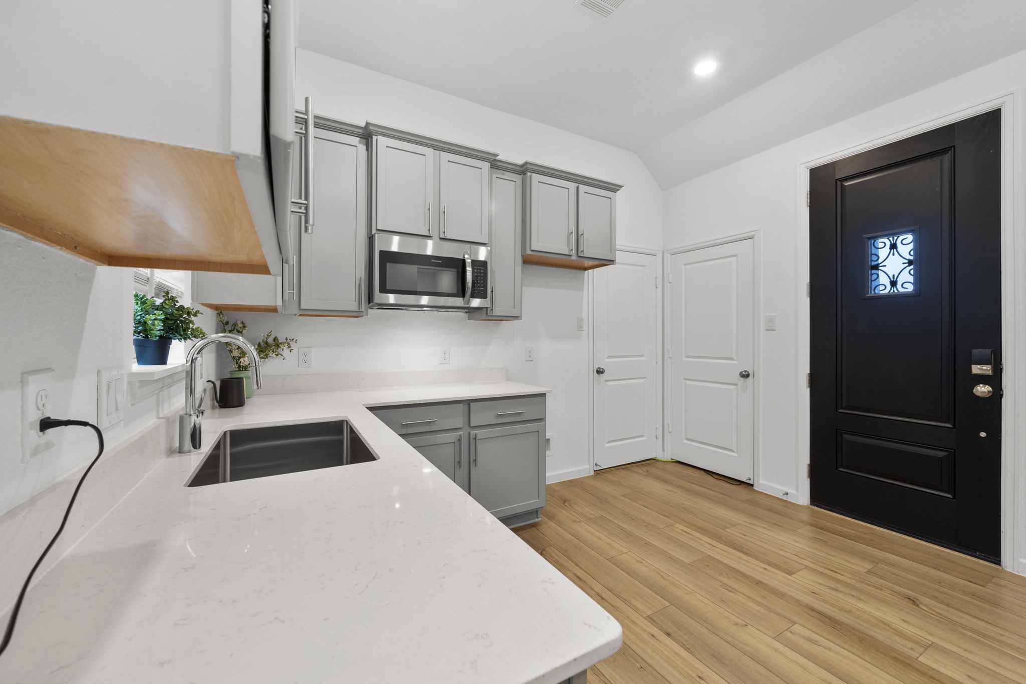 3704 Field Coast Lane Rosenberg, TX 77469 - Photo 30 of 49 Kitchen view with modern cabinetry and stainless steel appliances