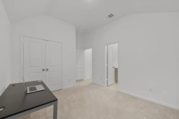 a bathroom with a sink toilet vanity and shower